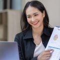 portrait-of-business-asian-woman-working-on-laptop-2023-11-27-05-33-00-utc