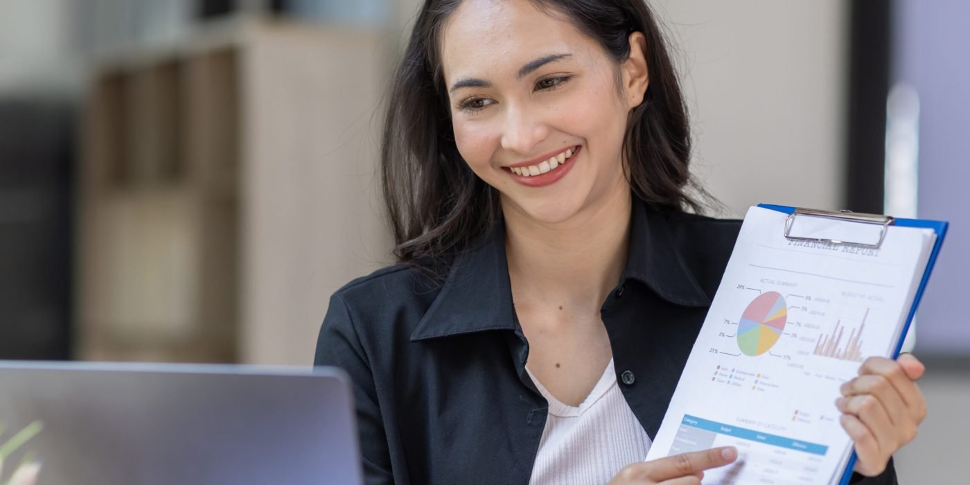 portrait-of-business-asian-woman-working-on-laptop-2023-11-27-05-33-00-utc